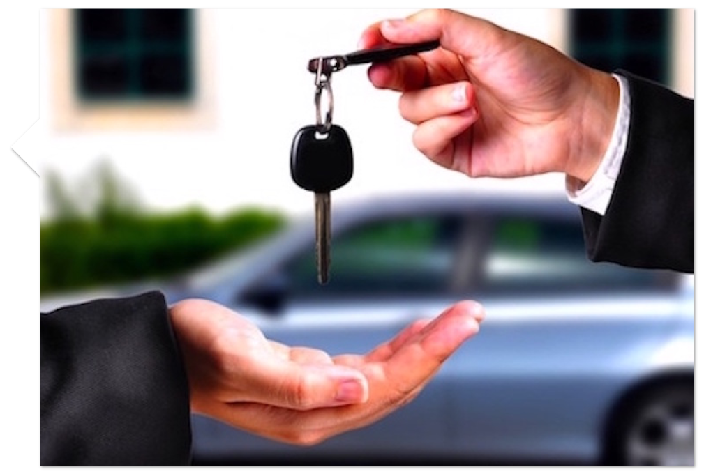 one person handing over keys to another person