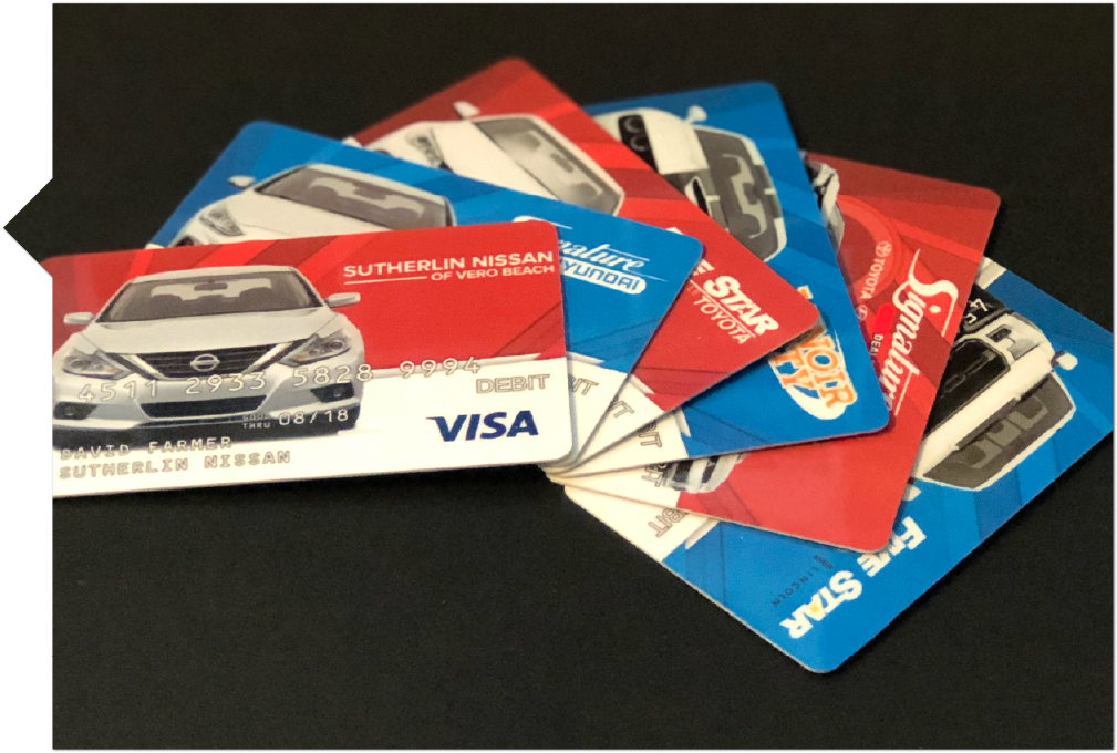 multiple Visa Gift cards with a Car on the front, used as an example for Visa Express Test Drive